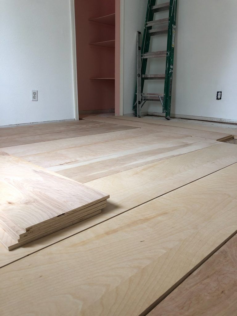 Installing new hardwood floors in modern residential interior space