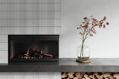 Modern minimalist fireplace with wood storage and concrete hearth design