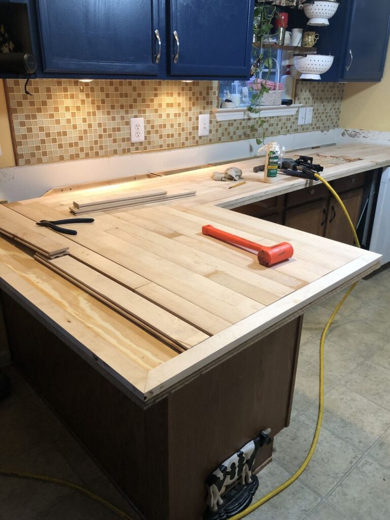 DIY wooden kitchen countertop installation in home renovation project